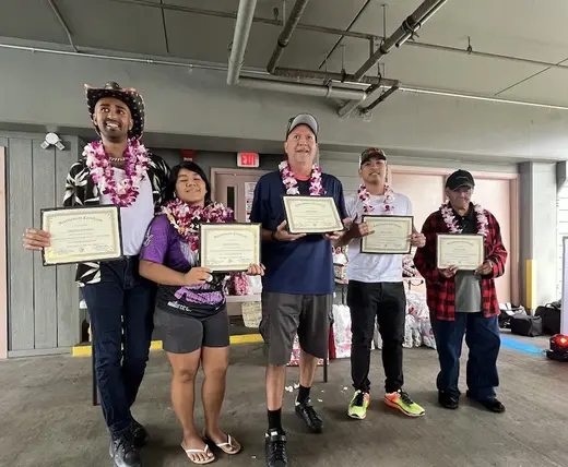 Celebratory group holding certificates at Dynamic Healing Center, a detox center in Hawaii.