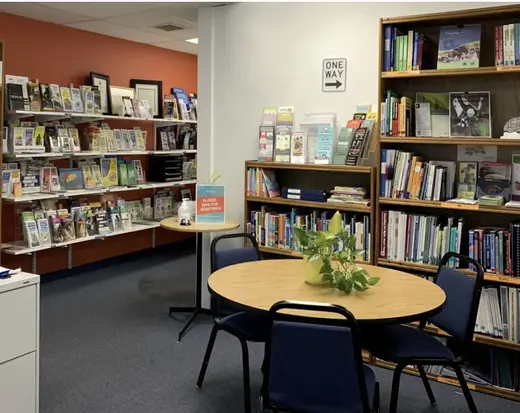 Inviting reading corner with bookshelves at Coalition for a Drug-Free Hawaii detox center in Hawaii.